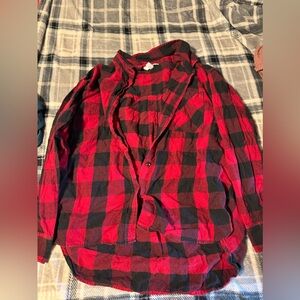 time and tru flannel. its a girls size large 12-14. it’s red and black plaid